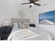 Guest bedroom with a queen-size bed and beachy decor at 2203 Avenue B, Bradenton Beach, FL 34217