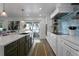 Bright kitchen with white cabinets, quartz countertops, and a view at 2203 Avenue B, Bradenton Beach, FL 34217