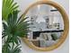 Reflective view of a bright kitchen and living area, featuring modern appliances and comfortable seating at 2203 Avenue B, Bradenton Beach, FL 34217