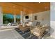 Covered patio with wicker furniture and a view of the pool at 2203 Avenue B, Bradenton Beach, FL 34217