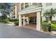 Condo building entrance with covered walkway and landscaping at 1002 S Harbour Island Blvd # 1502, Tampa, FL 33602