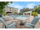 Relaxing pool area with lounge chairs and a table at 1002 S Harbour Island Blvd # 1502, Tampa, FL 33602