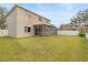 Large backyard with screened patio and fenced area at 10525 Lucaya Dr, Tampa, FL 33647