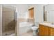 Clean bathroom with shower, tub and wood vanity at 10525 Lucaya Dr, Tampa, FL 33647