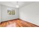 Simple bedroom with hardwood floors and a window at 10525 Lucaya Dr, Tampa, FL 33647