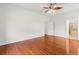 Large bedroom with wood floors and access to a bathroom at 10525 Lucaya Dr, Tampa, FL 33647