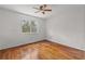 Bright bedroom with hardwood floors and a window at 10525 Lucaya Dr, Tampa, FL 33647