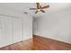 Spacious bedroom with hardwood floors and a ceiling fan at 10525 Lucaya Dr, Tampa, FL 33647