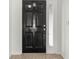 Simple entryway with black door and sidelight at 10525 Lucaya Dr, Tampa, FL 33647