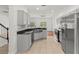 Modern kitchen with stainless steel appliances and granite countertops at 10525 Lucaya Dr, Tampa, FL 33647