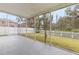 Spacious screened patio overlooking fenced backyard at 10525 Lucaya Dr, Tampa, FL 33647