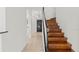 Elegant wooden staircase with a curved design at 10525 Lucaya Dr, Tampa, FL 33647