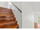 Elegant wooden staircase leading to the upper level at 10525 Lucaya Dr, Tampa, FL 33647