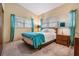 Well-lit bedroom with a comfortable bed at 11012 N Oregon Ave, Tampa, FL 33612