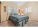 Bright bedroom with a double bed and window at 11012 N Oregon Ave, Tampa, FL 33612