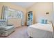 Charming bedroom with a comfortable armchair at 11012 N Oregon Ave, Tampa, FL 33612