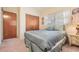 Spacious bedroom with double closet and bed at 11012 N Oregon Ave, Tampa, FL 33612