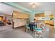 Bright dining area with kitchen views and vintage table at 11012 N Oregon Ave, Tampa, FL 33612