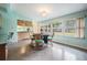 Charming dining area with light teal walls and a view of the backyard at 11012 N Oregon Ave, Tampa, FL 33612