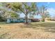 Ranch style home with brick facade and large yard at 11012 N Oregon Ave, Tampa, FL 33612