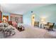 Bright living room with floral sofa and large windows at 11012 N Oregon Ave, Tampa, FL 33612