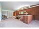 Living room showcasing a brick feature wall and comfortable seating at 11012 N Oregon Ave, Tampa, FL 33612