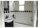 Bathroom with black and white diamond tile and a tub shower combo at 11798 104Th St, Largo, FL 33773