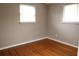 Simple bedroom with hardwood floors and neutral wall color at 11798 104Th St, Largo, FL 33773