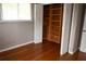 Bedroom with hardwood floors and a large closet with built-in shelves at 11798 104Th St, Largo, FL 33773