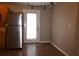 Kitchen dining area with wood floor and exterior access door at 11798 104Th St, Largo, FL 33773