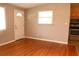 Bright living room with hardwood floors and access to the kitchen at 11798 104Th St, Largo, FL 33773