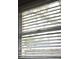 Window with white blinds, offering light and privacy at 11798 104Th St, Largo, FL 33773