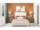 Bright bedroom with a white bed and orange accents at 11874 Sparkling Topaz Cv, Parrish, FL 34219