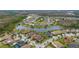 Aerial view of community near a tranquil lake at 12482 Wild Berry Trl, Odessa, FL 33556