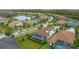 Aerial view of community, highlighting lake and homes at 12482 Wild Berry Trl, Odessa, FL 33556