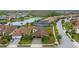 Aerial view of house and community, featuring a lake at 12482 Wild Berry Trl, Odessa, FL 33556