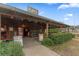 Rustic barn exterior with lush landscaping and inviting entrance at 12482 Wild Berry Trl, Odessa, FL 33556