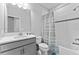 Clean bathroom with a shower/tub combo and gray vanity at 12482 Wild Berry Trl, Odessa, FL 33556