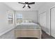 Bedroom with a ceiling fan and a queen-size bed at 12482 Wild Berry Trl, Odessa, FL 33556