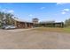 Rustic-style commercial buildings with ample parking at 12482 Wild Berry Trl, Odessa, FL 33556