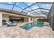 Enjoy this refreshing pool with screened enclosure and patio at 12482 Wild Berry Trl, Odessa, FL 33556