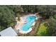 Community pool with plenty of lounge chairs at 12482 Wild Berry Trl, Odessa, FL 33556