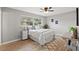 Cozy bedroom with a comfortable bed and wood flooring at 1300 S Hercules Ave # 12, Clearwater, FL 33764