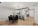 Dining area with black chairs and kitchen view at 1300 S Hercules Ave # 12, Clearwater, FL 33764