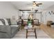 Bright living room features stylish furniture and a view into the kitchen at 1300 S Hercules Ave # 12, Clearwater, FL 33764