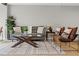 Relaxing living room with gray sofa and leather armchairs at 1300 S Hercules Ave # 12, Clearwater, FL 33764