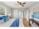 Bright main bedroom with a king-size bed and en-suite bathroom access at 1300 S Hercules Ave # 12, Clearwater, FL 33764