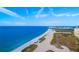 Wide aerial shot of beach, ocean, and coastal buildings at 1310 Gulf Blvd # 4-G, Clearwater, FL 33767