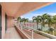 Private balcony overlooking tennis court and partial water view at 1310 Gulf Blvd # 4-G, Clearwater, FL 33767