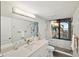 Modern bathroom with walk-in shower and ocean view at 1310 Gulf Blvd # 4-G, Clearwater, FL 33767